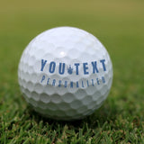A clean, crisp result of a custom Monogram name stamp on a golf ball, showing sharp, professional-looking initials.