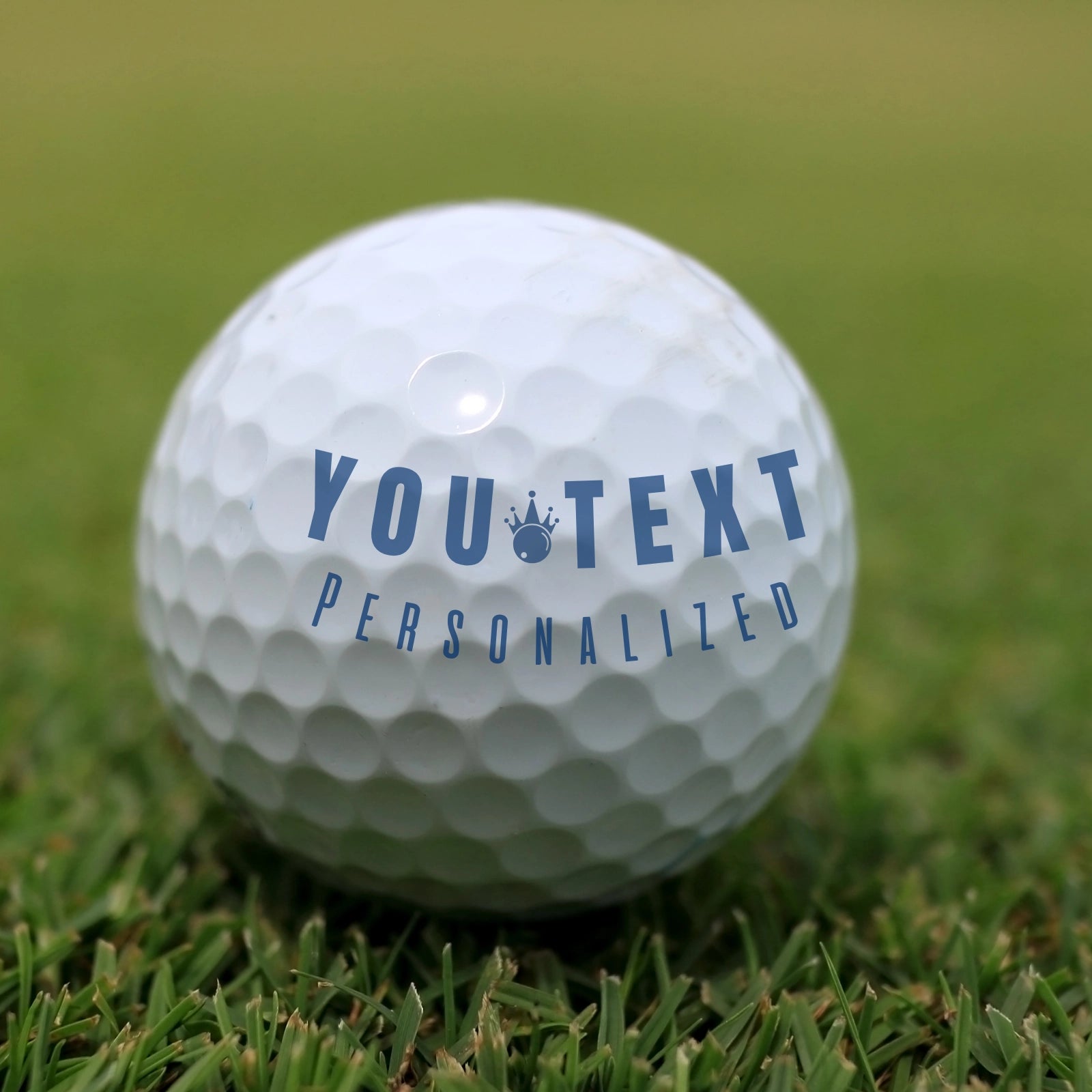 A clean, crisp result of a custom Monogram name stamp on a golf ball, showing sharp, professional-looking initials.
